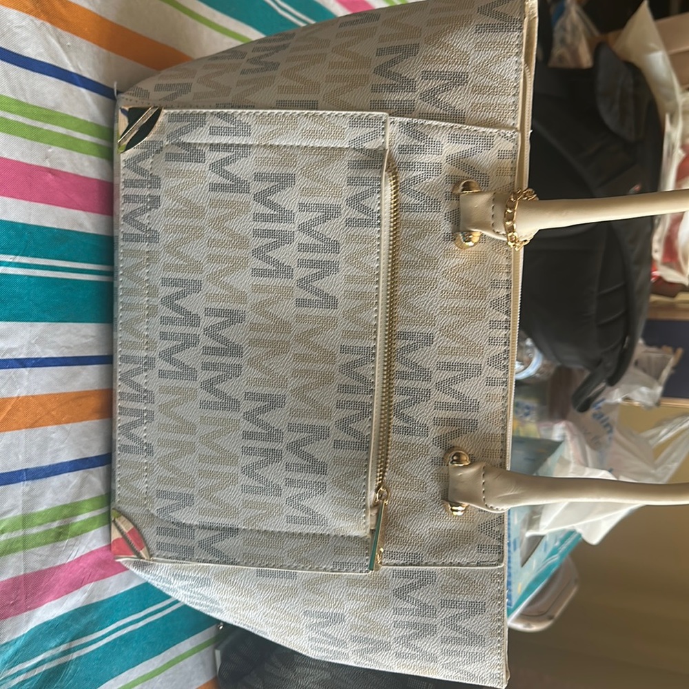 MKF collection cream medium and small purse set both pieces are brand new.